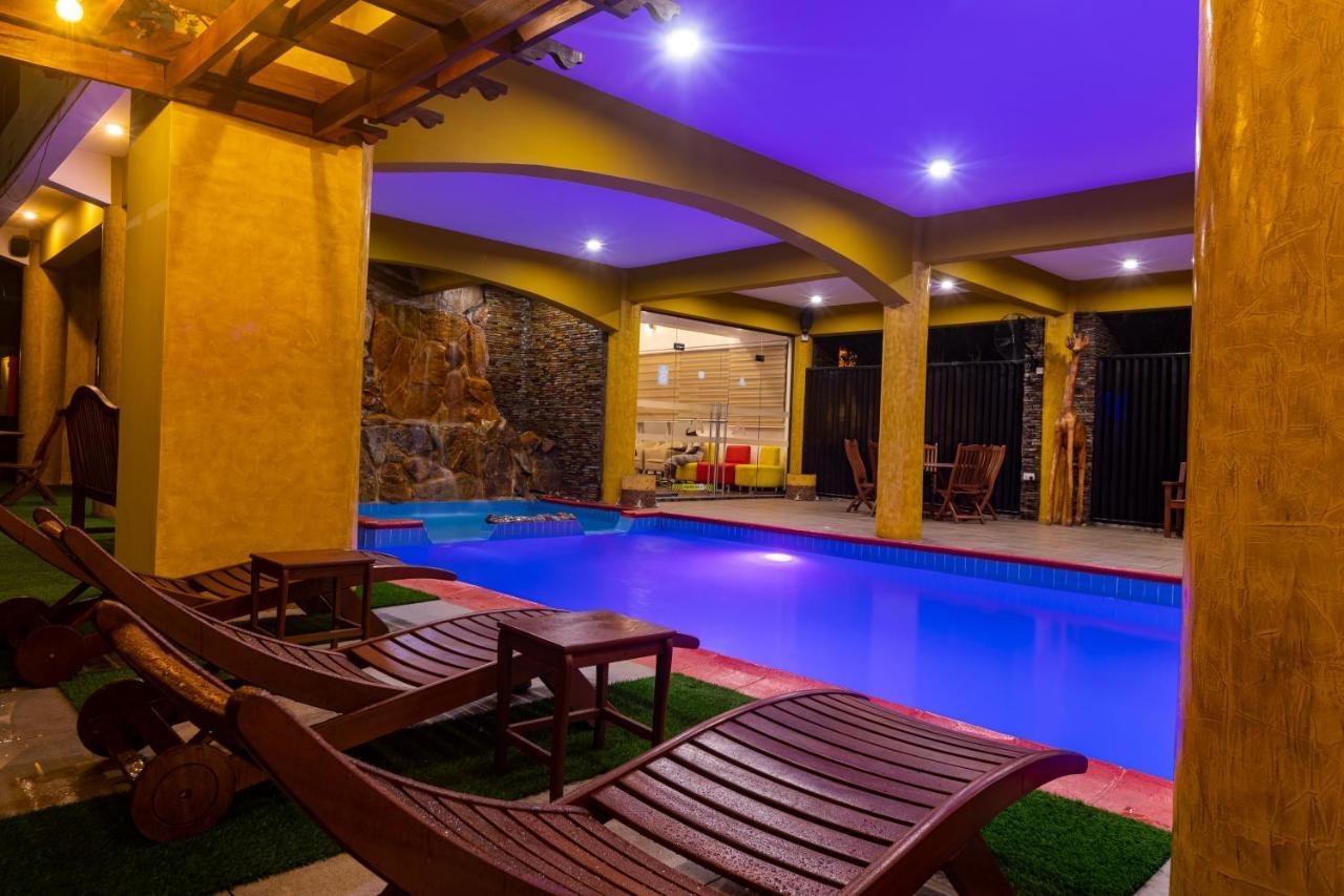 The heated indoor pool lit purple and blue at night