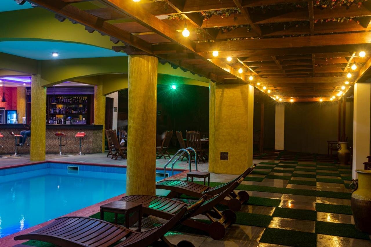 The pool with the bar lights glowing