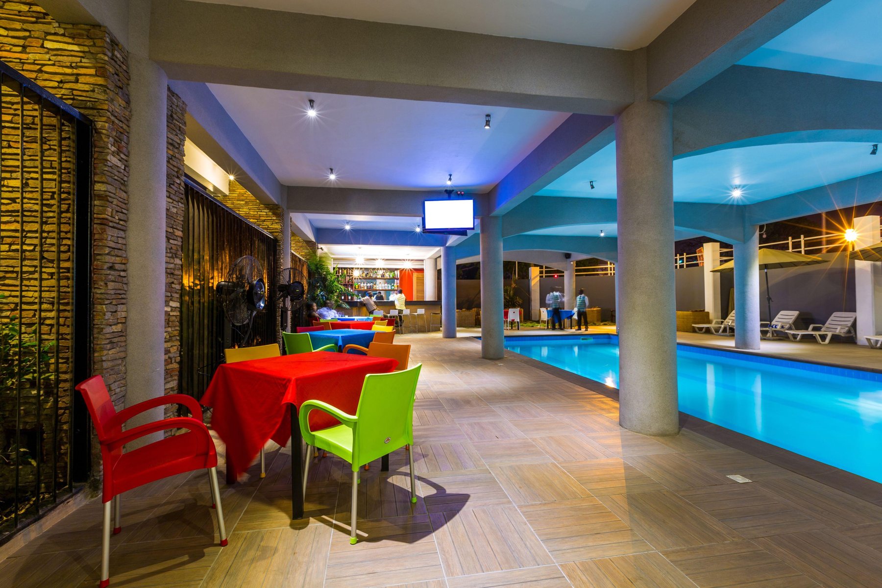 Tables set on the poolside dining terrace