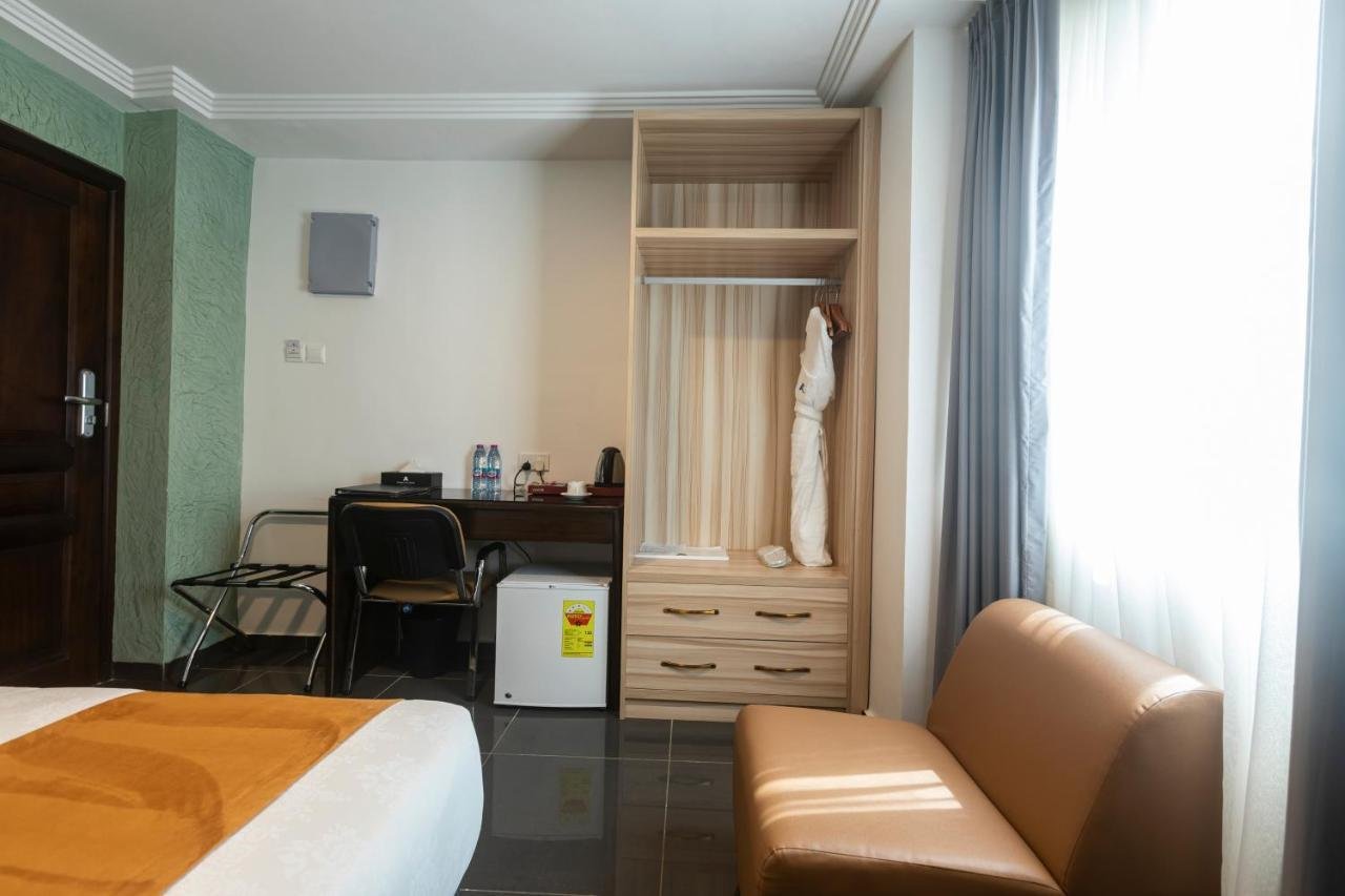 Deluxe Twin with desk, wardrobe and armchair